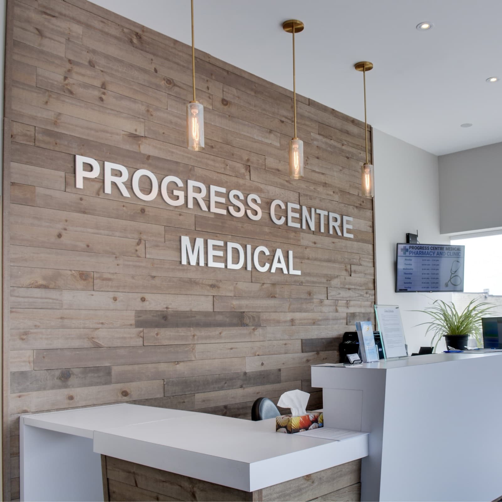 Reception desk under the Progress Centre Medical sign at 9 Progress Ave, Scarborough